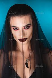 evil bride with dark makeup looking at