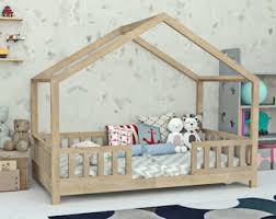This allows our daughter to get in and out of the bed without being confined to a crib or falling out of a higher bed and is supposed to promote independence. Montessori Bed Plan Etsy