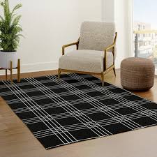 black and grey tartan rug by positively