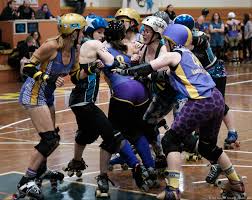 roller derby skaters show defensive