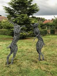 sculpture boxing hares fighting
