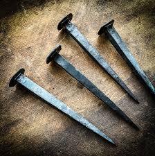 hand forged crucifixion nails axe