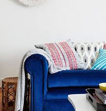 living rooms with blue velvet sofas
