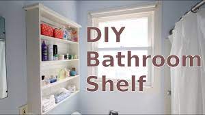 A stainless steel bathroom organizer shelf features a trio of rails for hanging towels, bath washcloths, bath brushes, loofahs and other items. Building A Diy Bathroom Wall Shelf For Less Than 20 Youtube