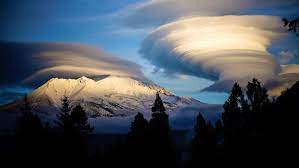 Shasta Mountain Guides - Mt. Shasta and lenticular clouds November 2018.  The first storms of the winter season brought over 3 feet of new snow to  the mountain. The clouds indicate more