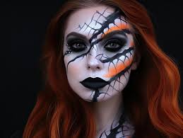 red hair and black and white face paint