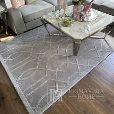 a modern gray rug with a geometric