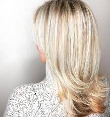 The overall color of the hair is more blonde from top to bottom, and dark lowlights peaking out throughout. How To Add Lowlights To Bleached Hair What Color Dye Should You Choose