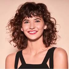 Messy curly bob + bangs. Short Curly Hairstyles That Will Give Your Spirals New Life Southern Living