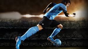 soccer player kicking ball hd wallpaper