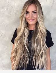 Give the hairstyle hight by wrapping a thick strand of hair at the base. Amazing Long Blonde Hair With Balayage