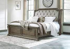 wyndahl brown upholstered queen bed