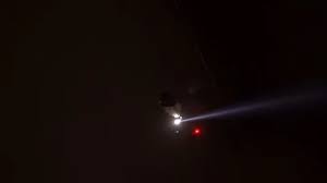 police helicopter with spotlight in los