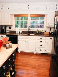 In order to continue your cabinet run against your window you need to do the following: Remodelaholic From Oak Kitchen Cabinets To Painted White Cabinets