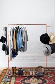 Ladders work wonders as a clothing display rack (if you're selling any clothing items). Diy Copper Clothes Rack Room Makeovers To Suit Your Life Hgtv