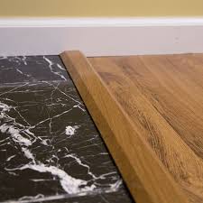 Transition piece looks exactly like a door threshold that separates the door from adjoining spaces. How To Install Vinyl Plank Flooring Lowe S