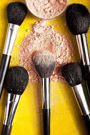 applying powder with makeup brushes on