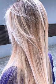 Wavy blonde long layered hairstyle with straight bangs. Long Layered Haircuts You Want To Get Now Lovehairstyles Com