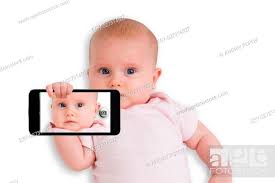 a cute baby taking selfie with a mobile