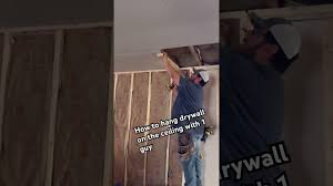 hanging drywall on the ceiling