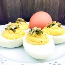 deviled eggs with dill pickles and chips