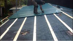 metal roof over shingles on a mobile