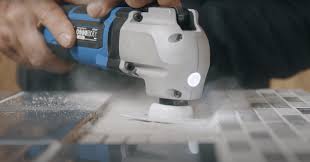 clean back tile adhesive with a multi tool
