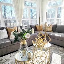 gray sectional with gold living room
