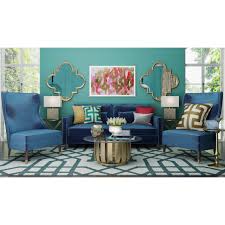 An example is black wrought iron legs of a glass coffee table with aubergine carpet and a teal sofa. Colors That Go With Teal Foter