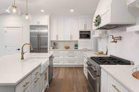This white kitchen remodel went from dark cherry cabinets and a closed off space to an open, bright space with white cabinets and reclaimed wood shelving. Kitchen Remodeling In Melbourne Fl Brevard County Kitchen Contractors