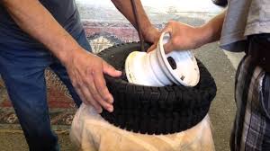 dismount and mount lawn mower tire