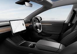 tesla to remove wood trim in the