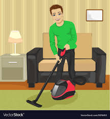 young man cleaning carpet with vacuum