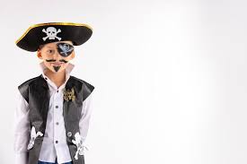 a little boy in a pirate costume and a