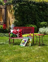 red metal garden bench