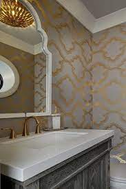 gray and gold powder room boasts walls