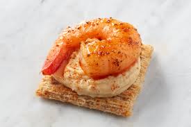 old bay topped triscuits hummus