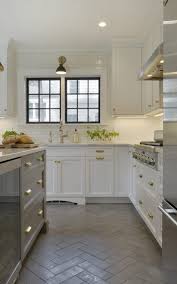 white kitchen with herringbone floor