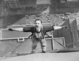 Image result for man hanging on side of building construction