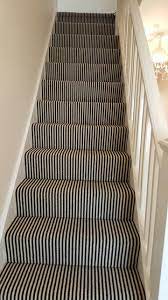 black white striped carpet to stairs