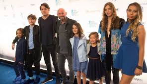 guy laliberte and his family arrive on