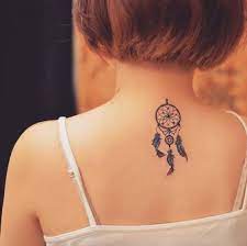 Check out these wolf dreamcatcher tattoo designs and. Small Dreamcatcher Tattoo On Girl Upper Back