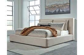 Includes footboard, rails and platform (no additional foundation/box spring needed). Langford Queen Upholstered Bed Ashley Furniture Homestore