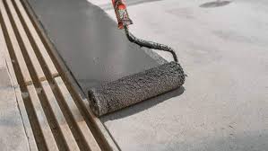 worker painting concrete floor