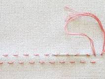 How do you end a cross stitch without a knot?