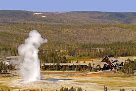 After a day spent exploring the park, guests relish the opportunity to relax in the iconic lobby, where the massive stone fireplace provides a compelling ambience. Old Faithful Inn Yellowstone National Park Lodges