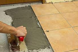 how to spread tile adhesive