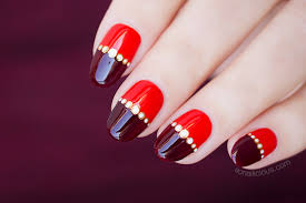 red nail design with magic gold