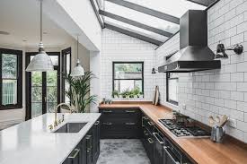 It features 2 doors on each side and a shelf about halfway up that runs throughout. Industrial Kitchen Ideas Cabinets Shelving Chairs And Lighting