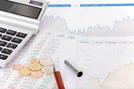 Stock Quotes Charts Tables Calculator And Money On A Desk